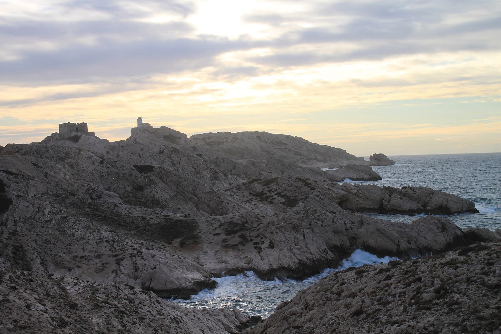 The rocky, scrub-covered coast of Île Pomègues in the Frioul archipelago