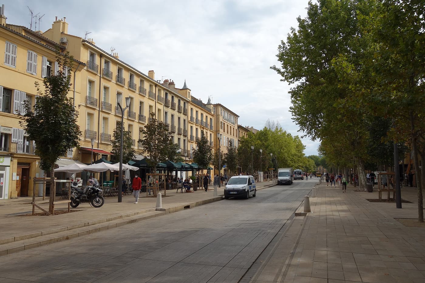 The plane-tree-lined Cours Mirabeau in Aix-en-Provence with café terraces